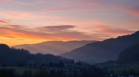 Experience the tranquility of a cozy village nestled in a valley, bathed under a vibrant, colorful sky. Gentle light softly i