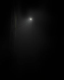 Capture the mysterious ambiance of a night alley with this high-resolution stock photo. Thick fog hangs heavy, obscuring visi