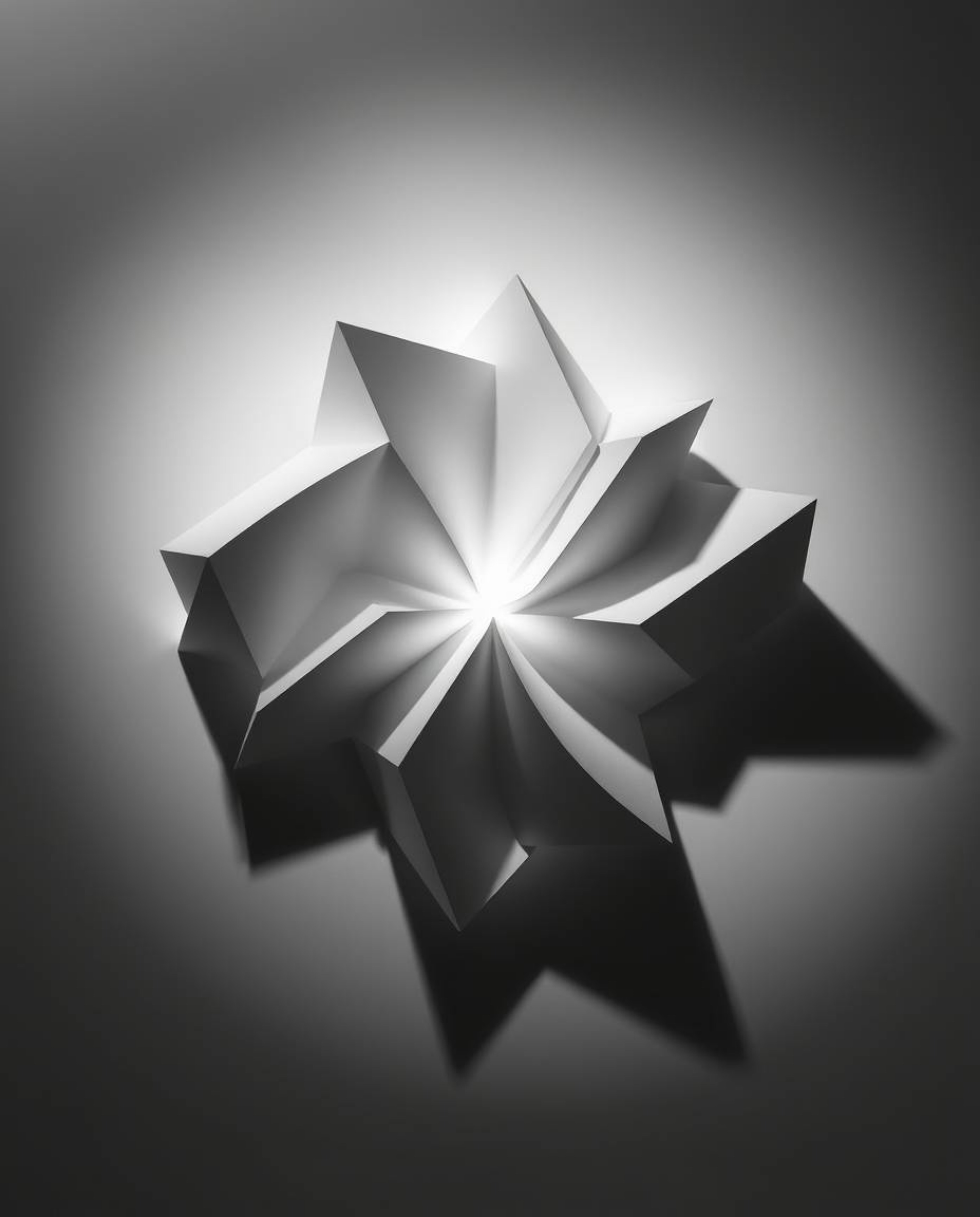 A captivating monochrome image showcasing a 3D geometric pattern reminiscent of folded paper, bathed in soft light and diffus
