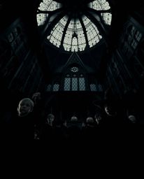 Explore a captivating scene: a magical school teeming with young wizards, captured from a dramatic low angle.  Intense jet bl