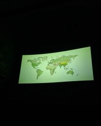 This image evokes a sense of mystery and intrigue, showcasing a glowing map projected in the air within a vintage study. The 