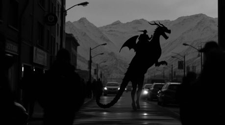 A captivating monochrome street photograph captures the eerie atmosphere of a dark urban scene.  A silhouetted dragon and rid
