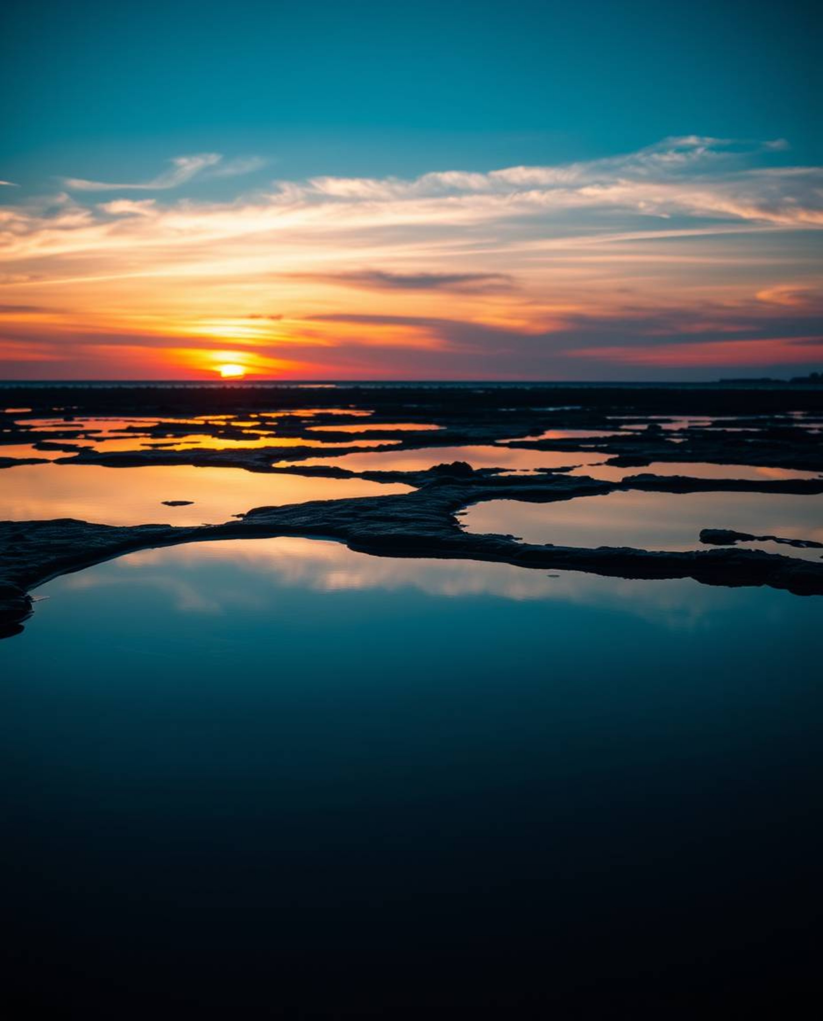A professional photograph, reminiscent of Associated Press and editorial photography, captures a cool-toned sunset sky—featur
