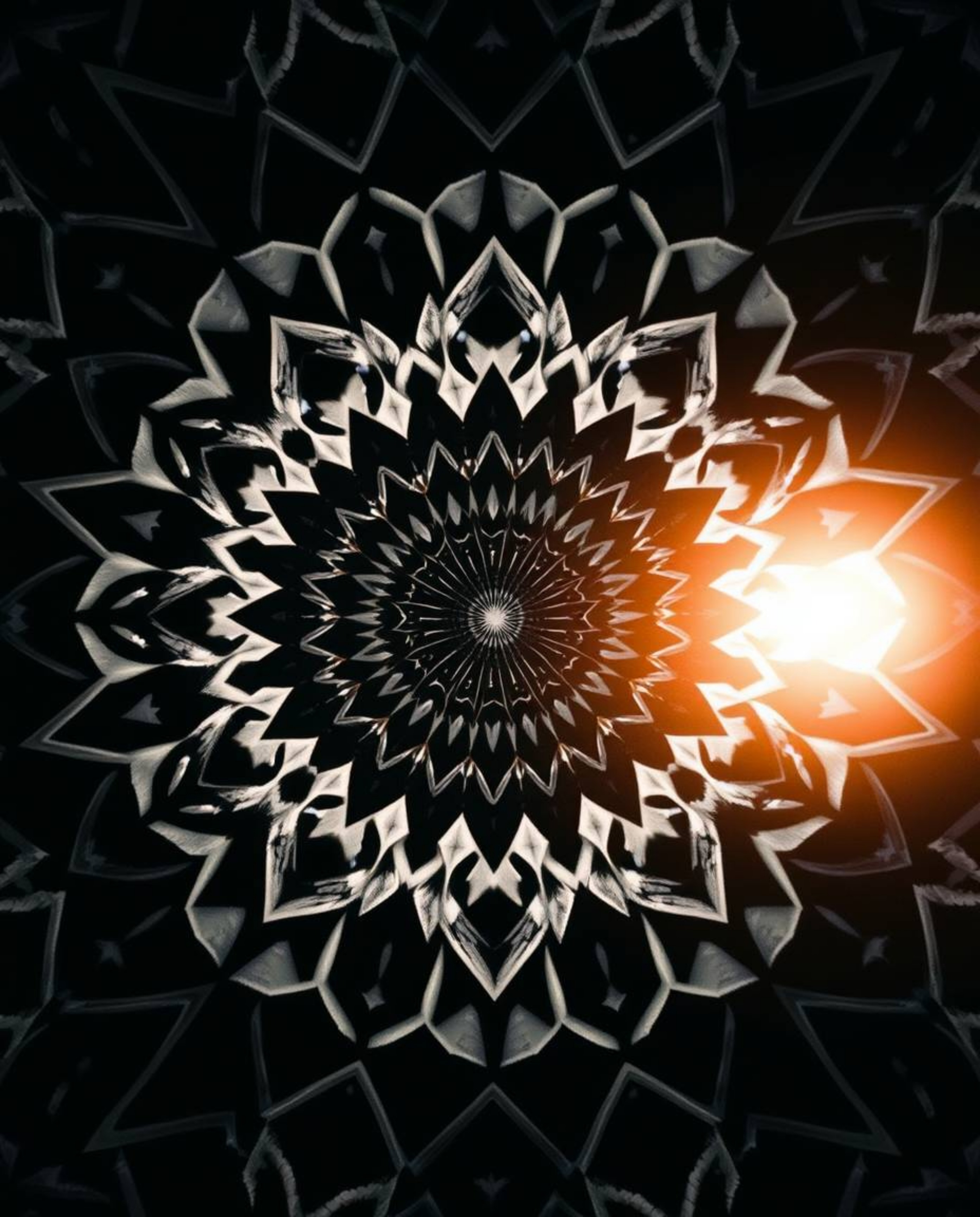 This captivating black and white image features a mesmerizing geometric pattern in an optical illusion style, immediately tra