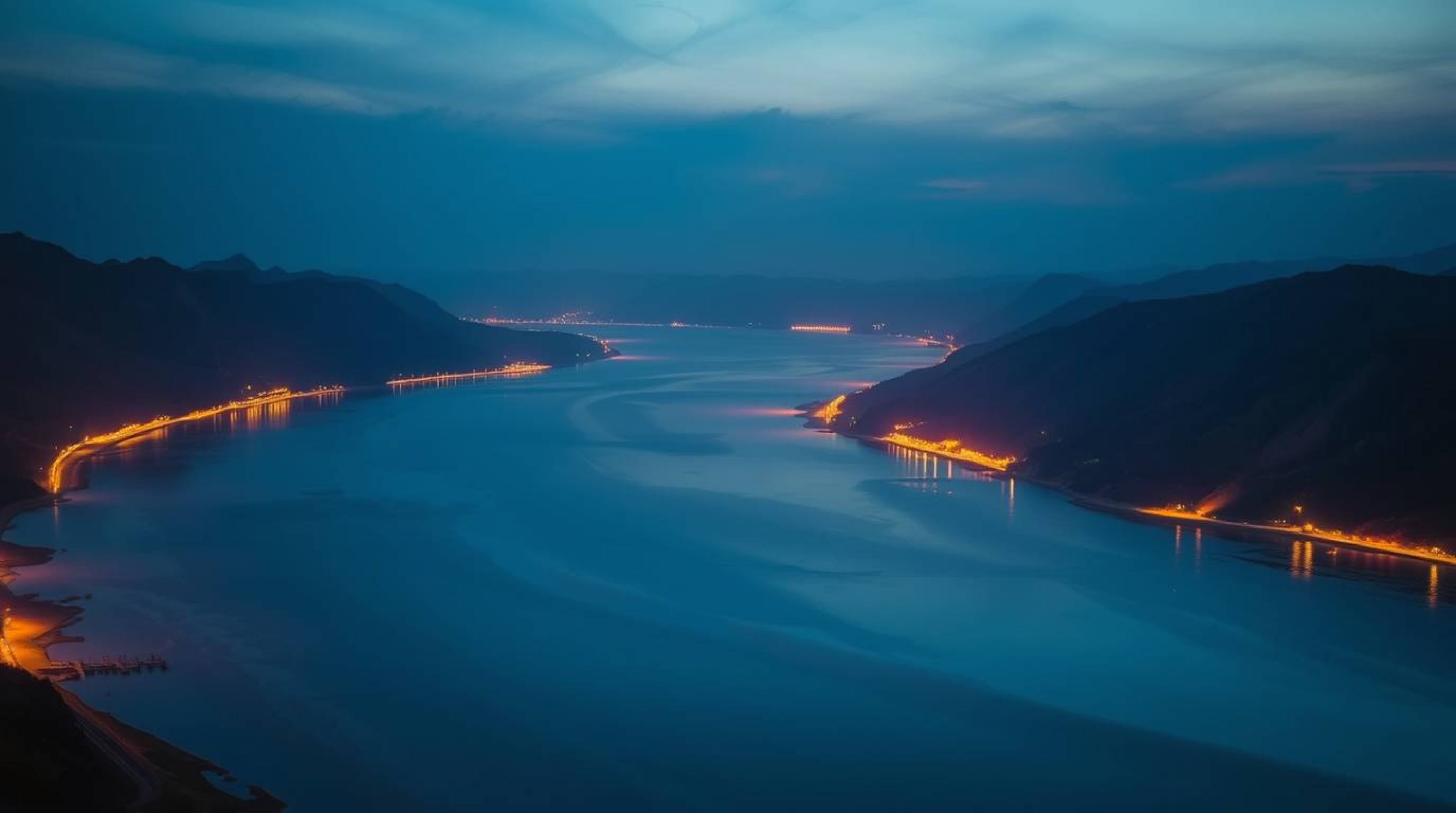 A stunning photograph captures a river delta at twilight, radiating with electric and vivid colors. The scene is bathed in a 
