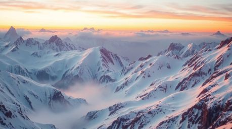 A breathtaking landscape showcasing snow-covered mountains illuminated by a soft pastel sunset. The scene evokes a dreamlike 