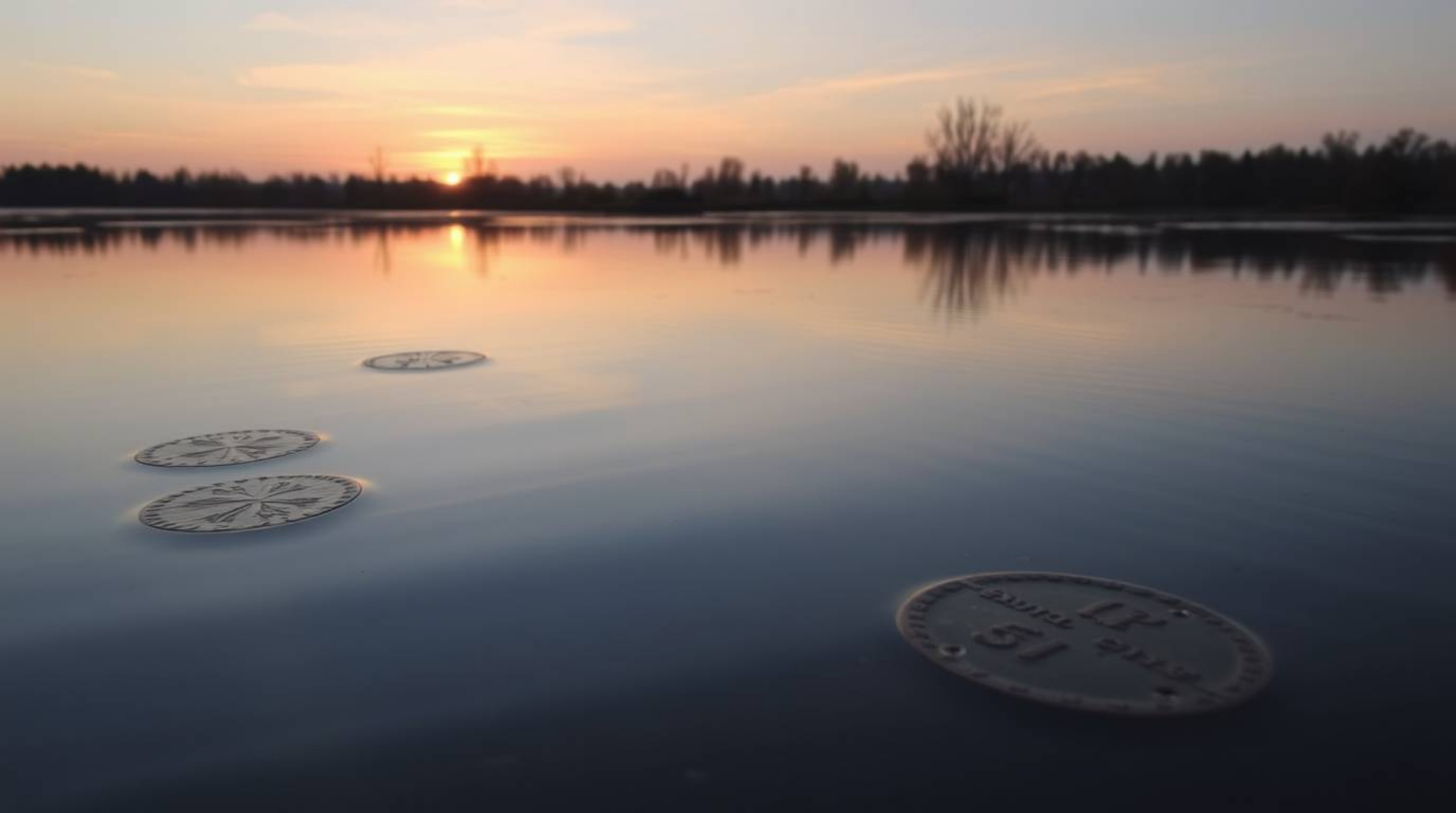 Experience the tranquility of a calm pond reflecting a soft pastel sunset. This artwork evokes a sense of peace with its cast