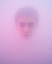 A captivating digital glitch art portrait rendered in surreal infrared tones.  The image features a thick fog, creating a low