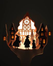 Explore a mesmerizing layered papier-mâché sculpture depicting a magical school brimming with young wizards. The silhouetted 