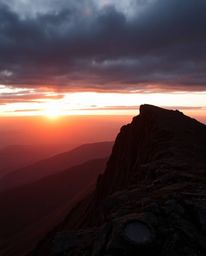 This is a high-resolution stock photo capturing a sunset from a high alpine peak in a strong, moody style. Designed for comme