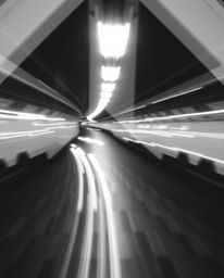 This collection features long-exposure black and white photographs that capture motion and light trails, skillfully incorpora
