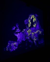 Explore a captivating deep ultraviolet glowing map projection in an old study, captured in a tight close-up shot. Vivid purpl
