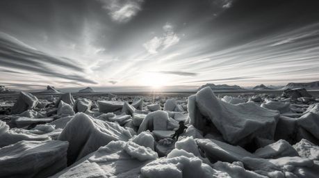 Explore a dreamlike world of surreal black and white imagery featuring a timeless and elegant sunset over icy polar glaciers.