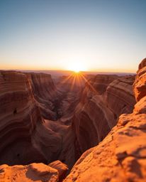 An extreme macro, high-resolution stock photo presents a professional quality image of a sunset illuminating sandstone cliffs