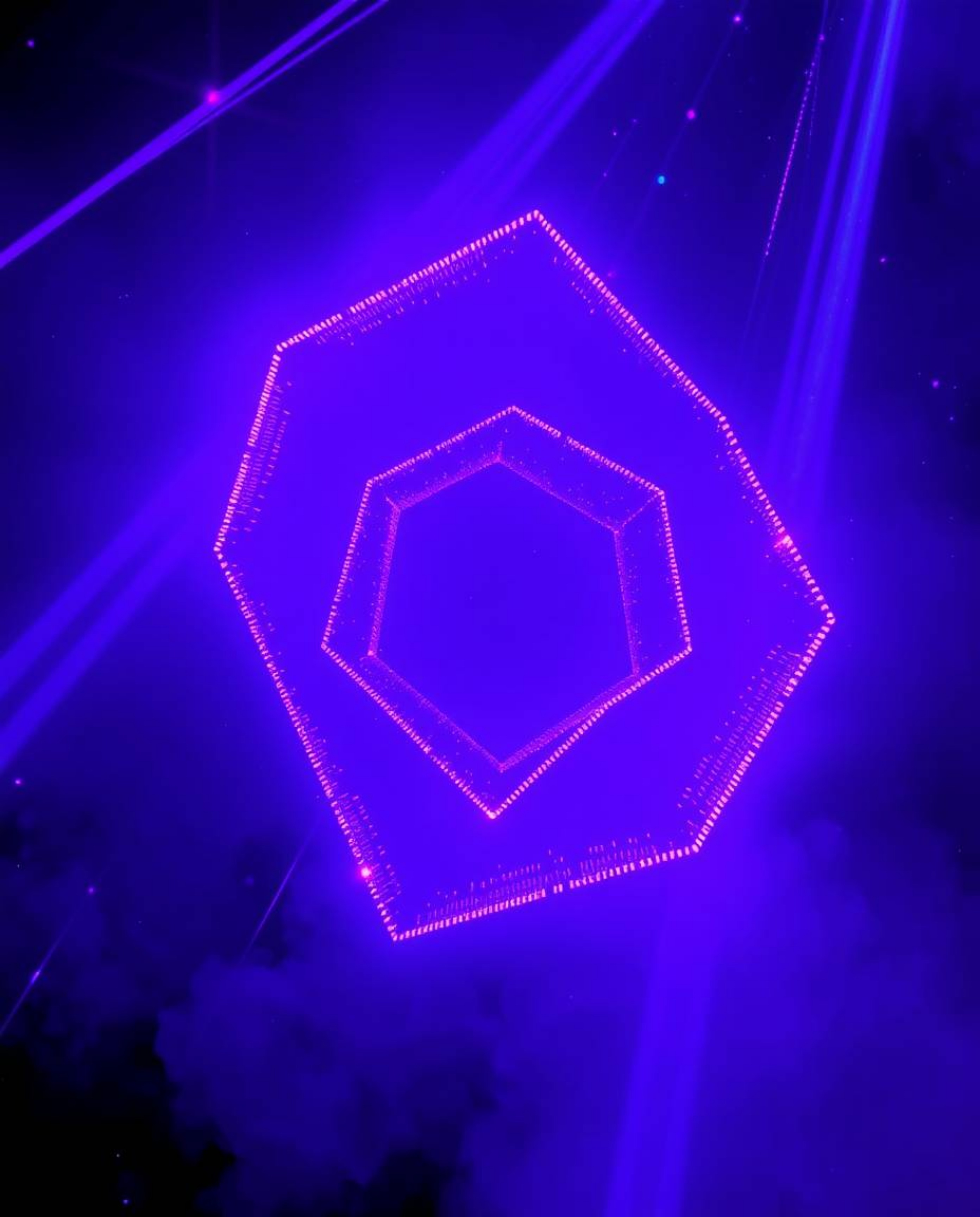 Experience the vibrant energy of glitched geometric shapes floating in a cyberspace matrix.  Volumetric lighting illuminates 