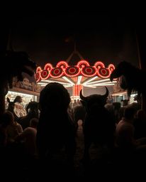 Explore a haunting, high-contrast photograph of a carnival overrun by wild animals. This eerie and creepy scene is brought to