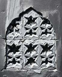 A captivating black and white acrylic painting that beautifully portrays Islamic geometric patterns intricately carved in sto