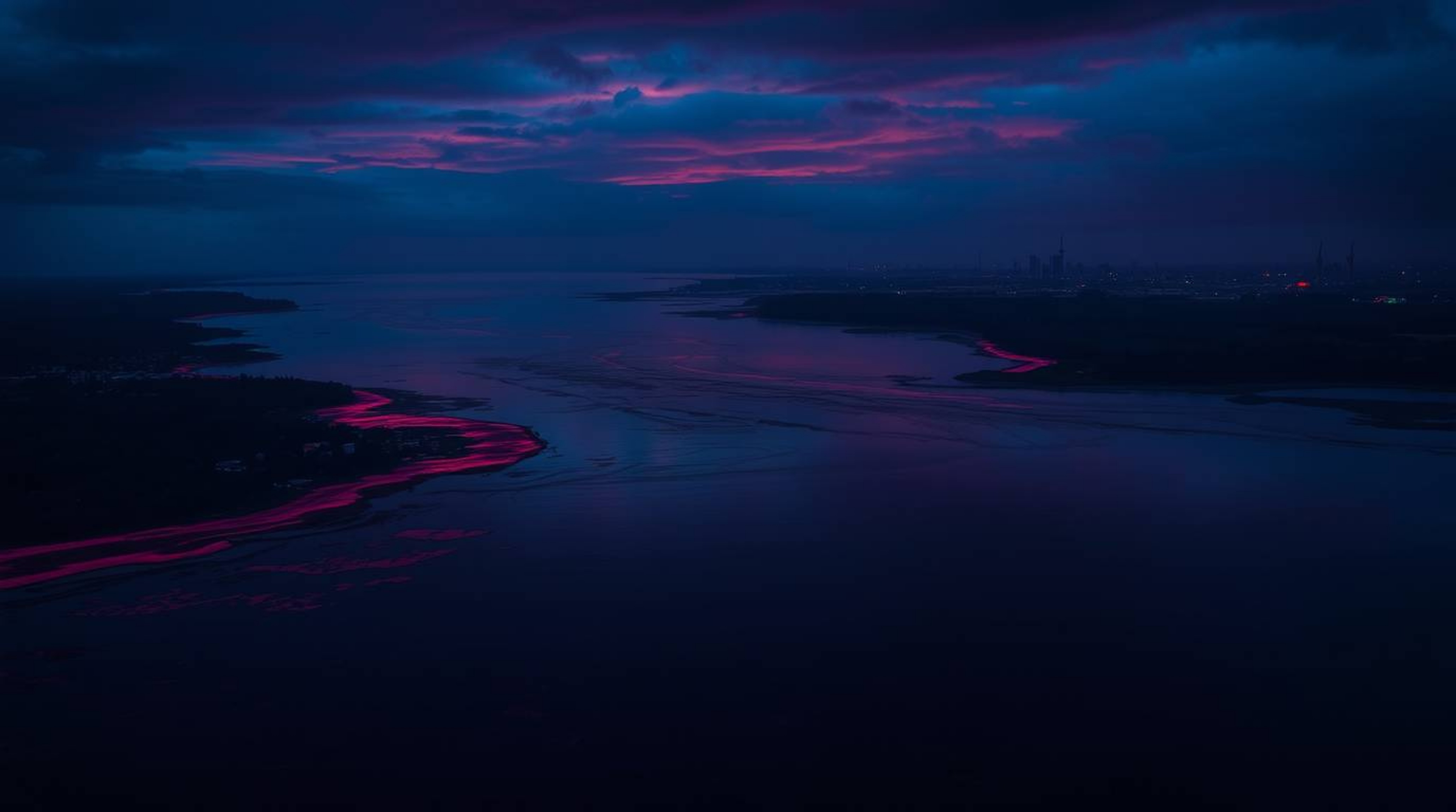 Experience the unsettling yet sophisticated elegance of a river delta bathed in twilight colors. Rich burgundy and deep blue 