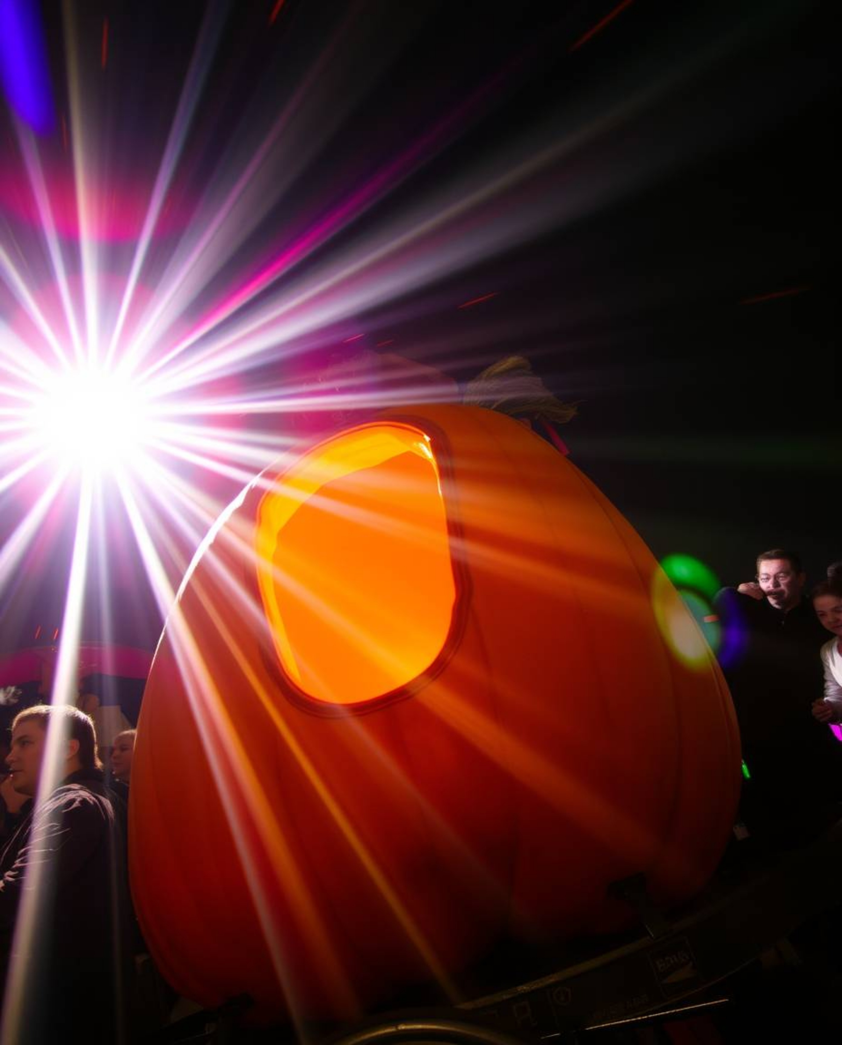 A captivating image showcasing a magical pumpkin transforming into a carriage.  Low angle, bright lens flares and vibrant col