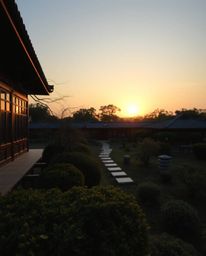 Experience an elegant and graceful depiction of a serene Zen garden at sunset. This artwork is characterized by its refined f