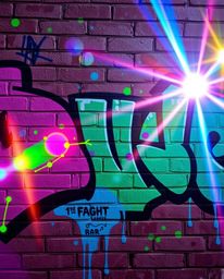 A vibrant image depicts graffiti-style colorful splashes on a brick wall.  The artwork is enhanced by bright lens flares and 