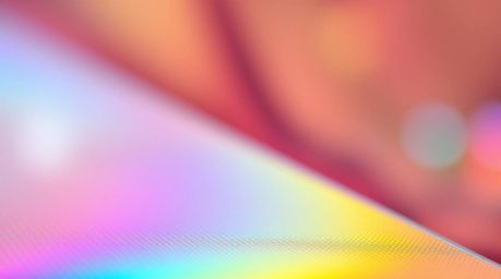 A captivating visual showcases bright, vibrant colors blending into a mesmerizing bokeh effect, accentuating an iridescent gr