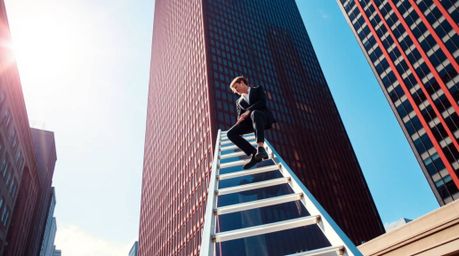 A captivating candid street photograph depicts a businessperson with a radiant aura ascending a transparent ladder that disap