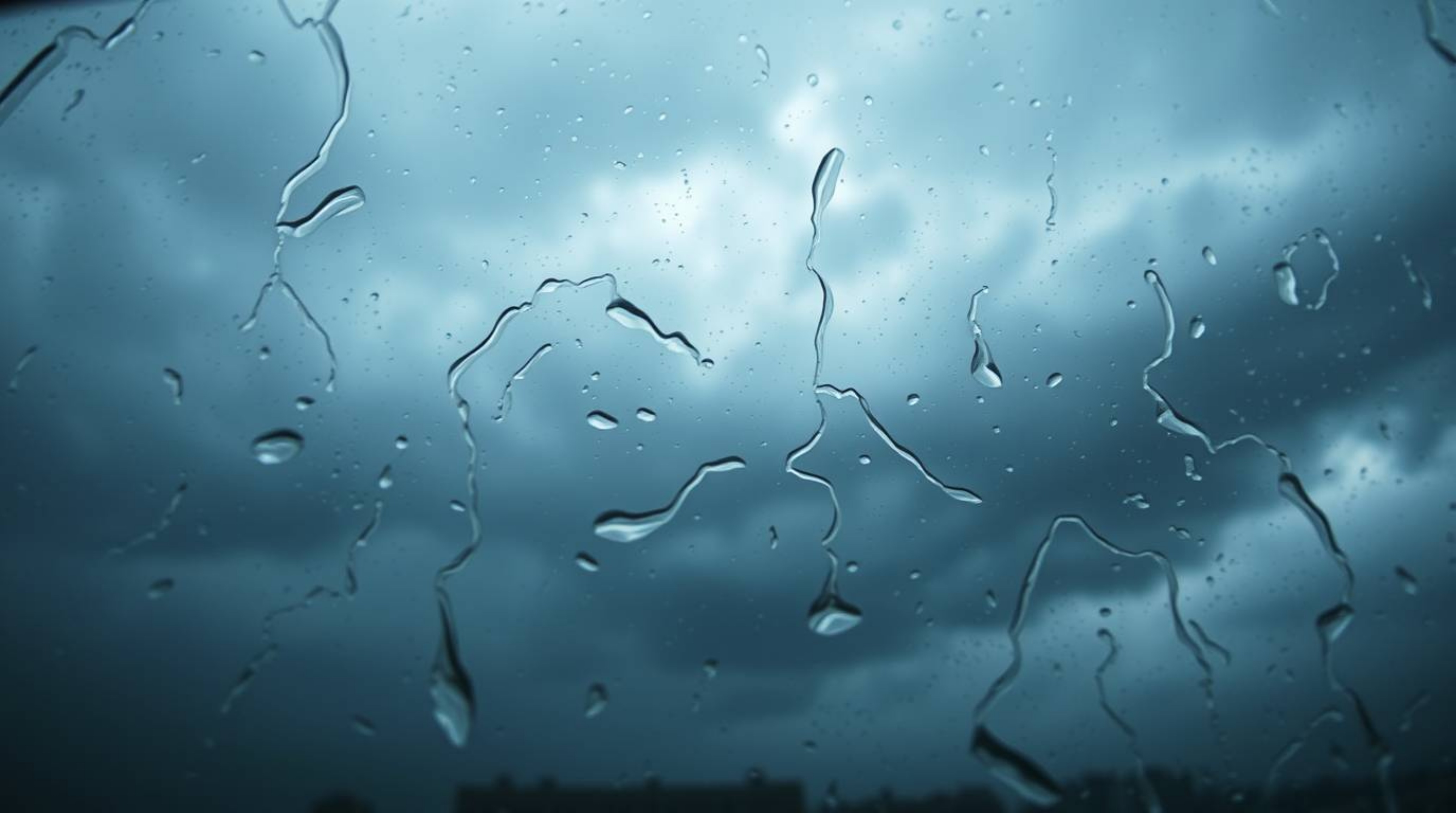 Experience the intensity of dramatic weather captured through a high-angle perspective of a glass object, reflecting smooth g