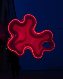 Explore the unsettling beauty of eerie street photography featuring candid shots of futuristic 3D fluid shapes with glowing e