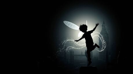 A captivating image of a young boy with dark hair and fair skin, silhouetted against a stark black backdrop, soaring above a 