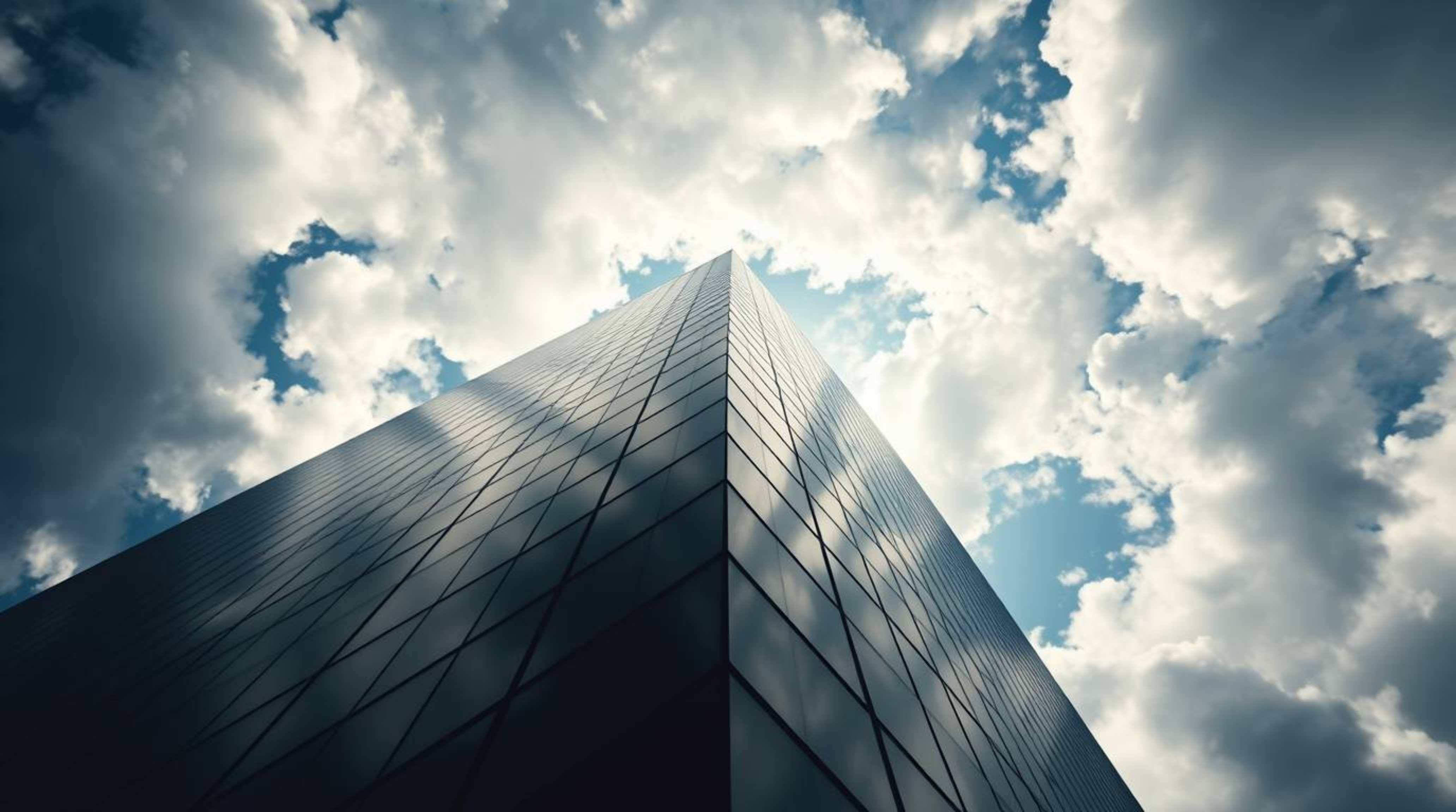 A captivating low-angle shot depicts a modern glass building seemingly dissolving into a soft, cloudy sky.  The image utilize