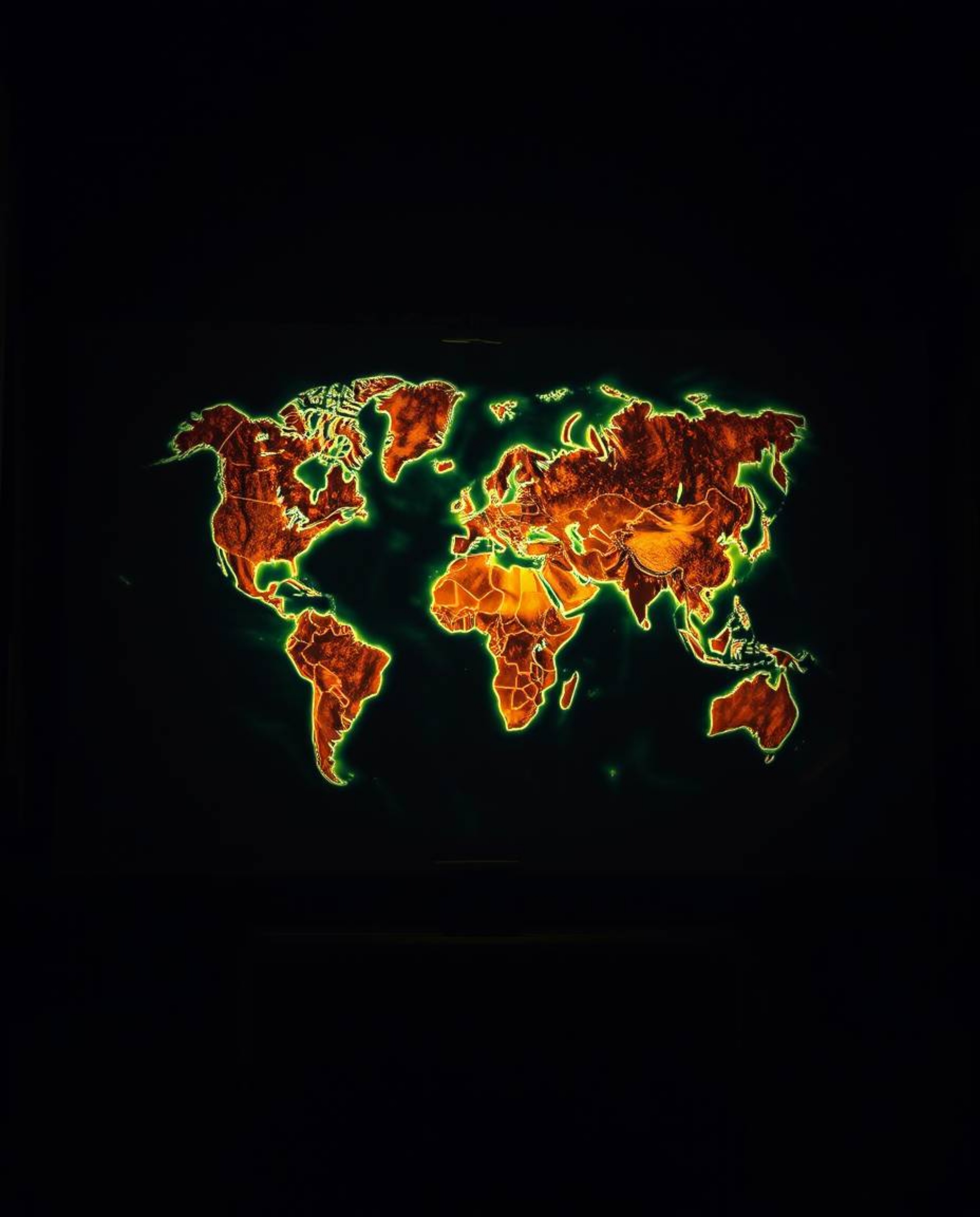 A captivating overhead bird's-eye view showcases a glowing map projected within the confines of an antique study. The scene i
