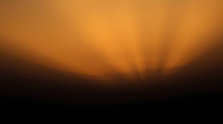 This image showcases a strong, moody style with hard, dramatic lighting and a gradient texture reminiscent of a sunset sky.  