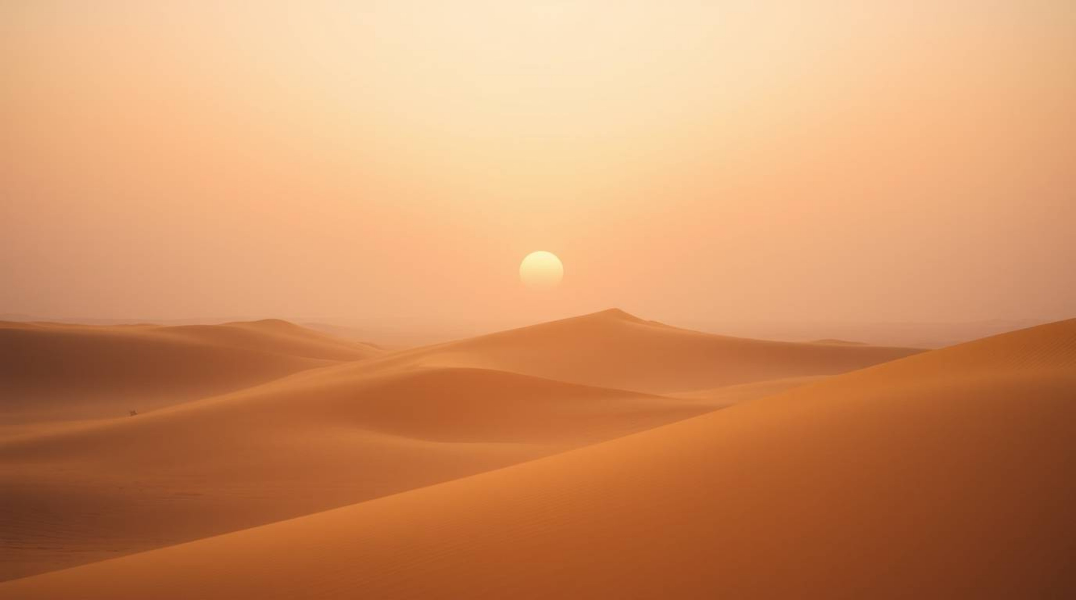 Experience a soft, cinematic sunset at the edge of a mesmerizing desert landscape, adorned with rolling golden dunes. The haz