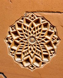 Discover a captivating image showcasing the beauty of Islamic geometric patterns meticulously carved into stone. This vibrant