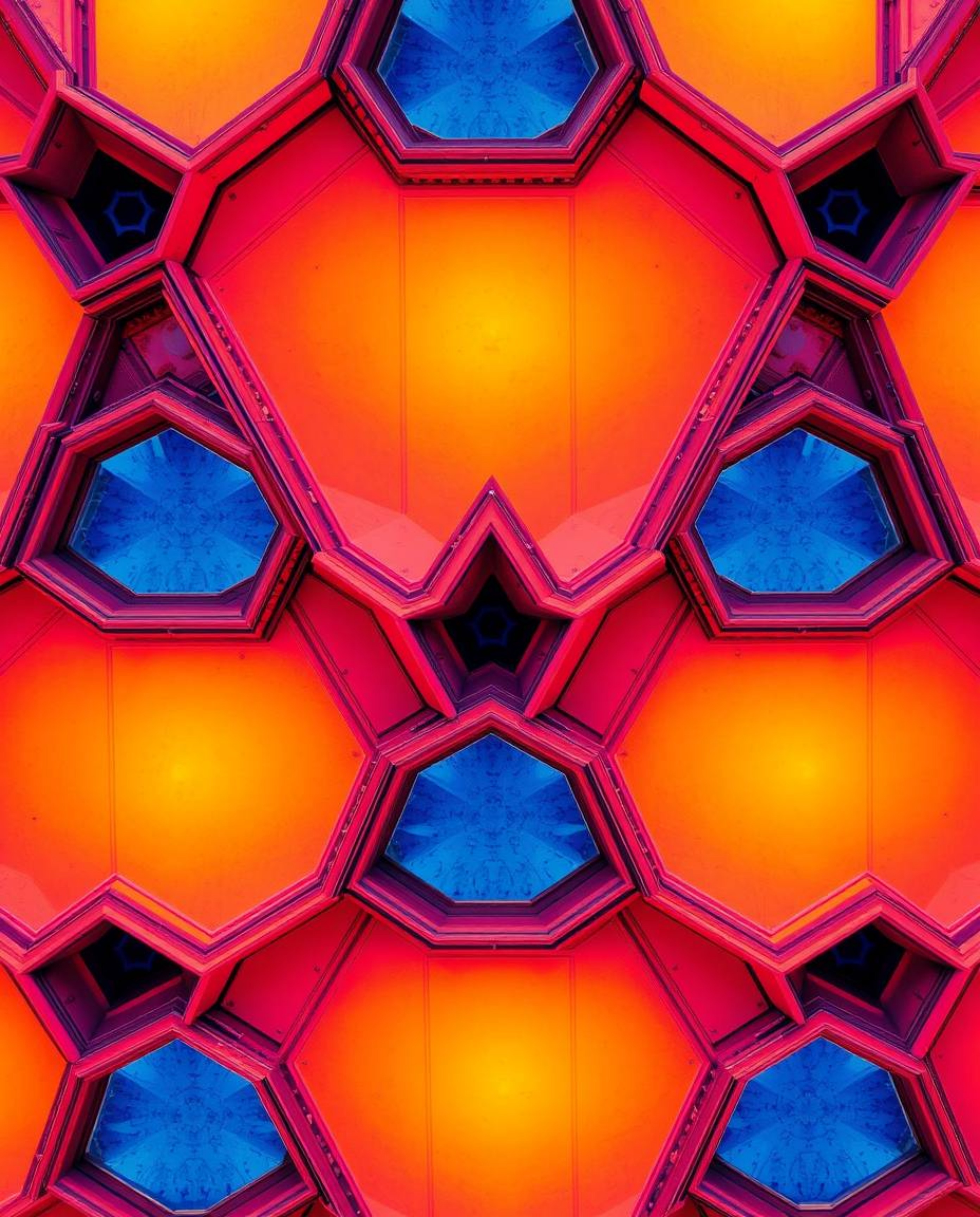 A stunning overhead architectural photograph showcases a seamless geometric pattern of hexagons and triangles in a vibrant ne