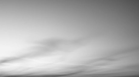 A timeless and elegant classic black and white photograph featuring a soft, dreamy gradient texture reminiscent of a sunset s