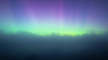 High-resolution stock photo showcasing thick fog with extremely low visibility, featuring a stunning aurora borealis inspired