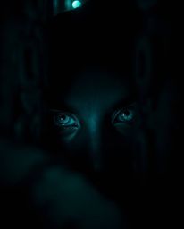 A captivating image featuring deep teal eyes that pierce through the shadows of a night alley. The scene is rendered with lux