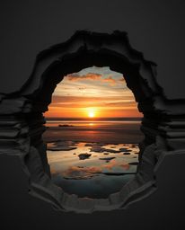 A strong, moody, low-contrast image of layered papier-mâché mirrors a sunset sky as it's reflected in the tidal pools of a be