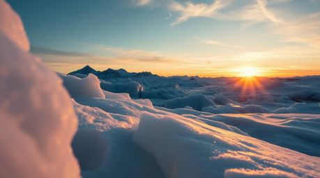 A stunning close-up shot showcases a breathtaking sunset over icy polar glaciers.  The image features a distinct split framin