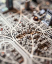 This captivating photograph showcases an abstract city map constructed from geometric shapes, captured from a high-angle pers