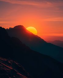This is a piece of creative light art depicting a sunset from a high alpine peak. The artwork is distinguished by its use of 