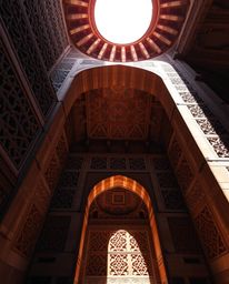 This collection showcases stunning Islamic geometric patterns carved in stone, captured with a dramatic low angle and strong,