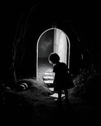 A captivating black and white image portrays a child's wondrous encounter with a magical portal nestled within their own back