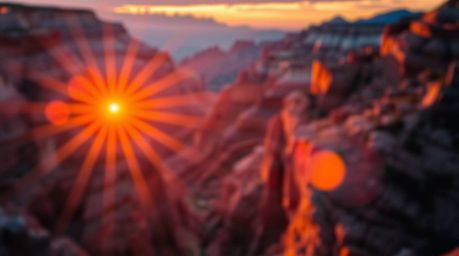 A breathtaking image of a rocky canyon bathed in the warm hues of a setting sun.  Intense, dramatic lighting creates a high-c