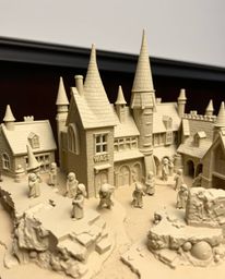 Discover a captivating sculptural clay model depicting a magical school brimming with young wizards. The artwork emphasizes