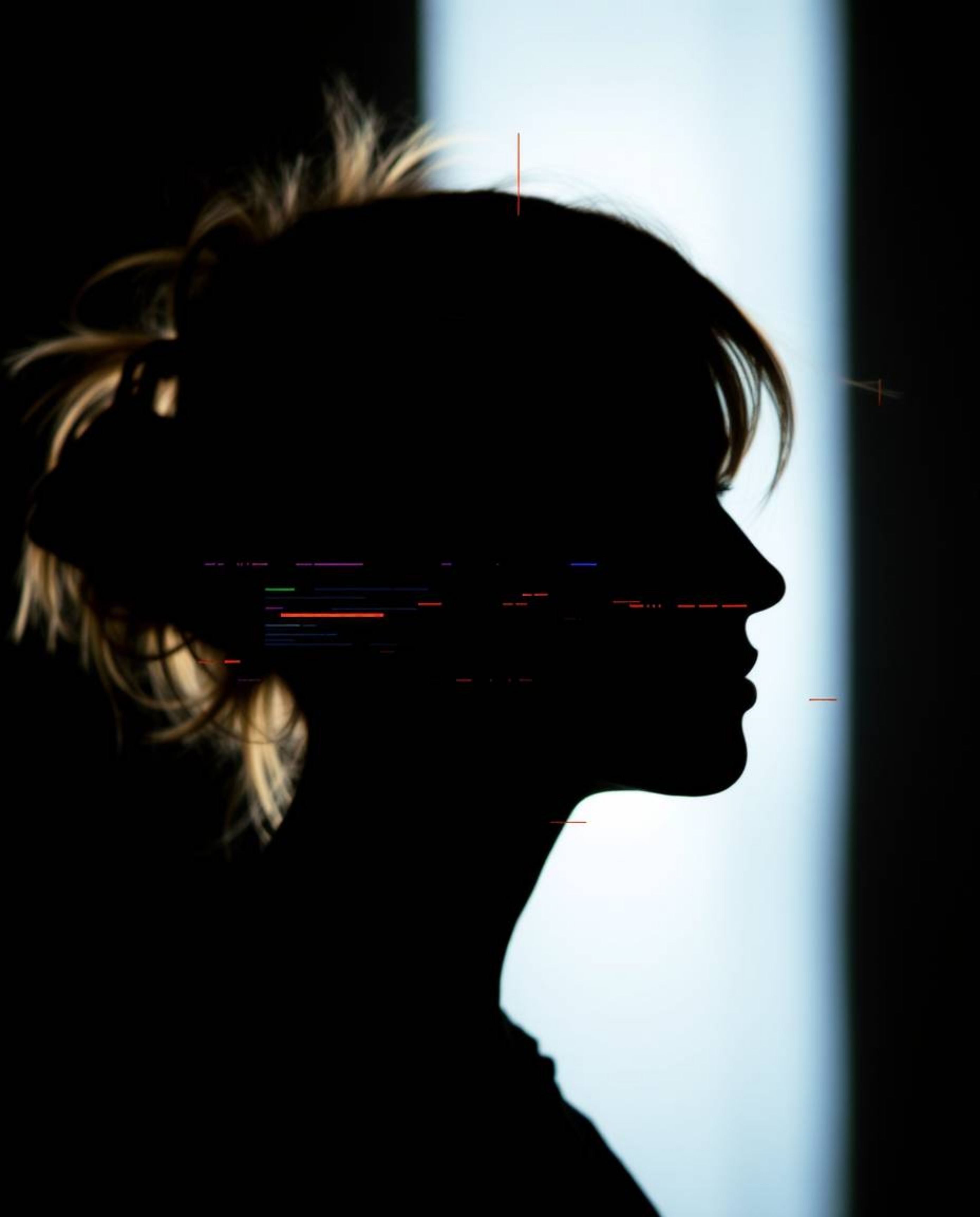 A captivating close-up shot reveals abstract shapes silhouetted against a bright backlight.  The image showcases striking gli