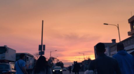 Capture the spontaneous beauty of urban life with this candid street photograph.  The image features a captivating gradient s
