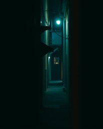 An ethereal fine art photograph captures the captivating presence of eyes watching from the shadows of a night alley. The ima